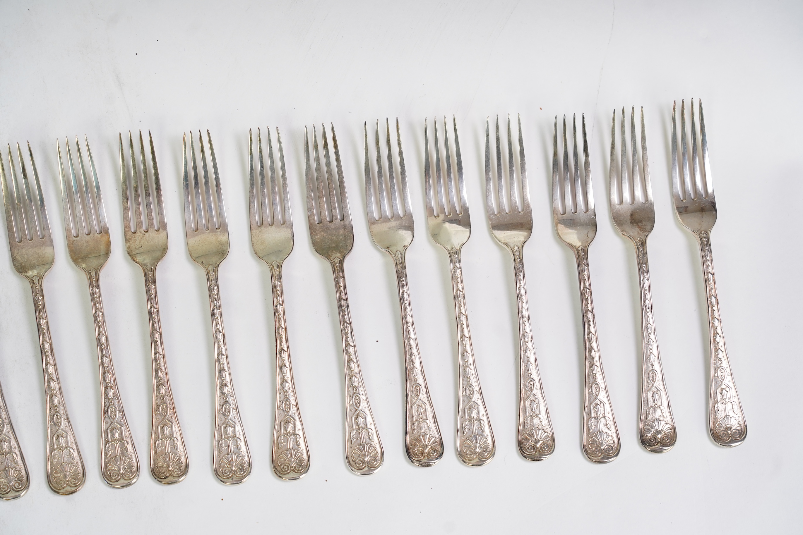 A harlequin set of twenty one Victorian and later silver fancy pattern table forks